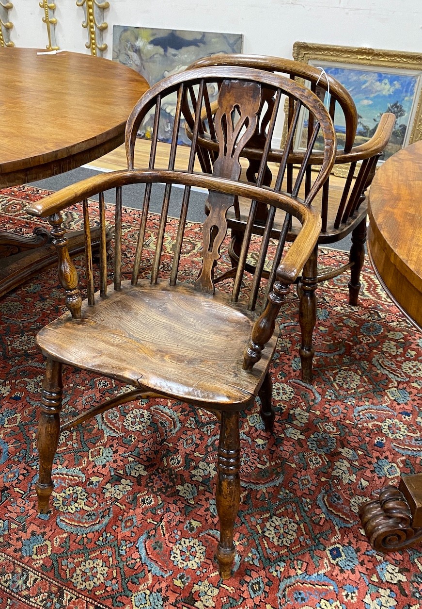 A near pair of 19th century Lincolnshire ash and elm Windsor elbow chairs, width 55cm, depth 38cm, height 91cm